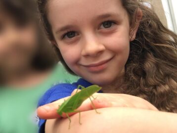 Girl and grasshopper girl and grasshopper