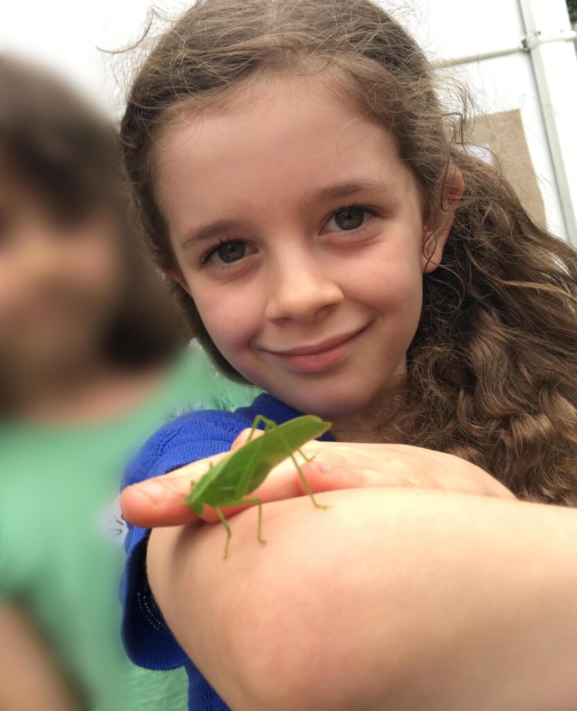 girl and grasshopper