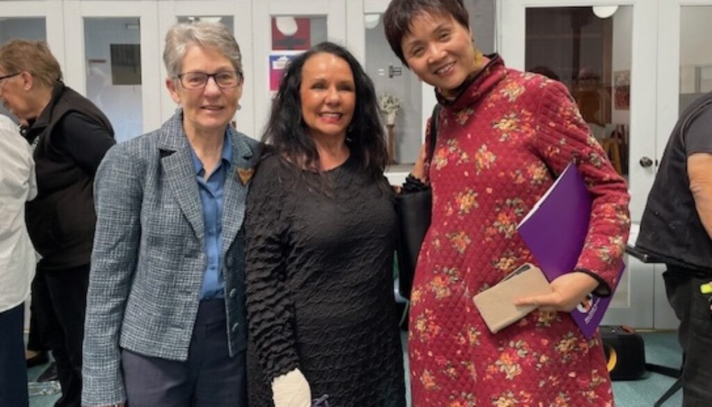 Julie Green and Lydia Feng receive certificate from Linda Burney