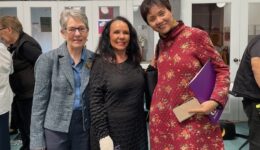 Julie Green and Lydia Feng receive certificate from Linda Burney