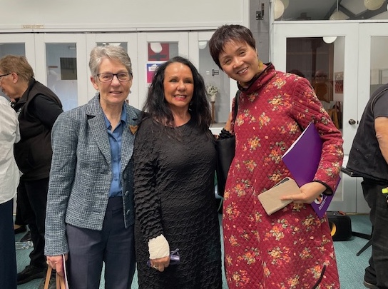 Julie Green and Lydia Feng receive certificate from Linda Burney