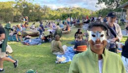 woman in mask at picnic